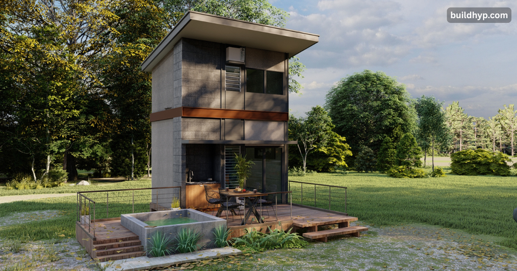 Ultra-modern minimalist 2 story tiny home surrounded by trees, featuring a ground-floor patio deck with a small outdoor plunge pool.